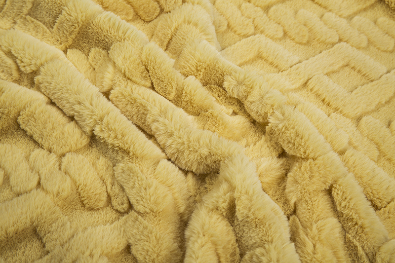 Weft knitted jacquard artificial fur